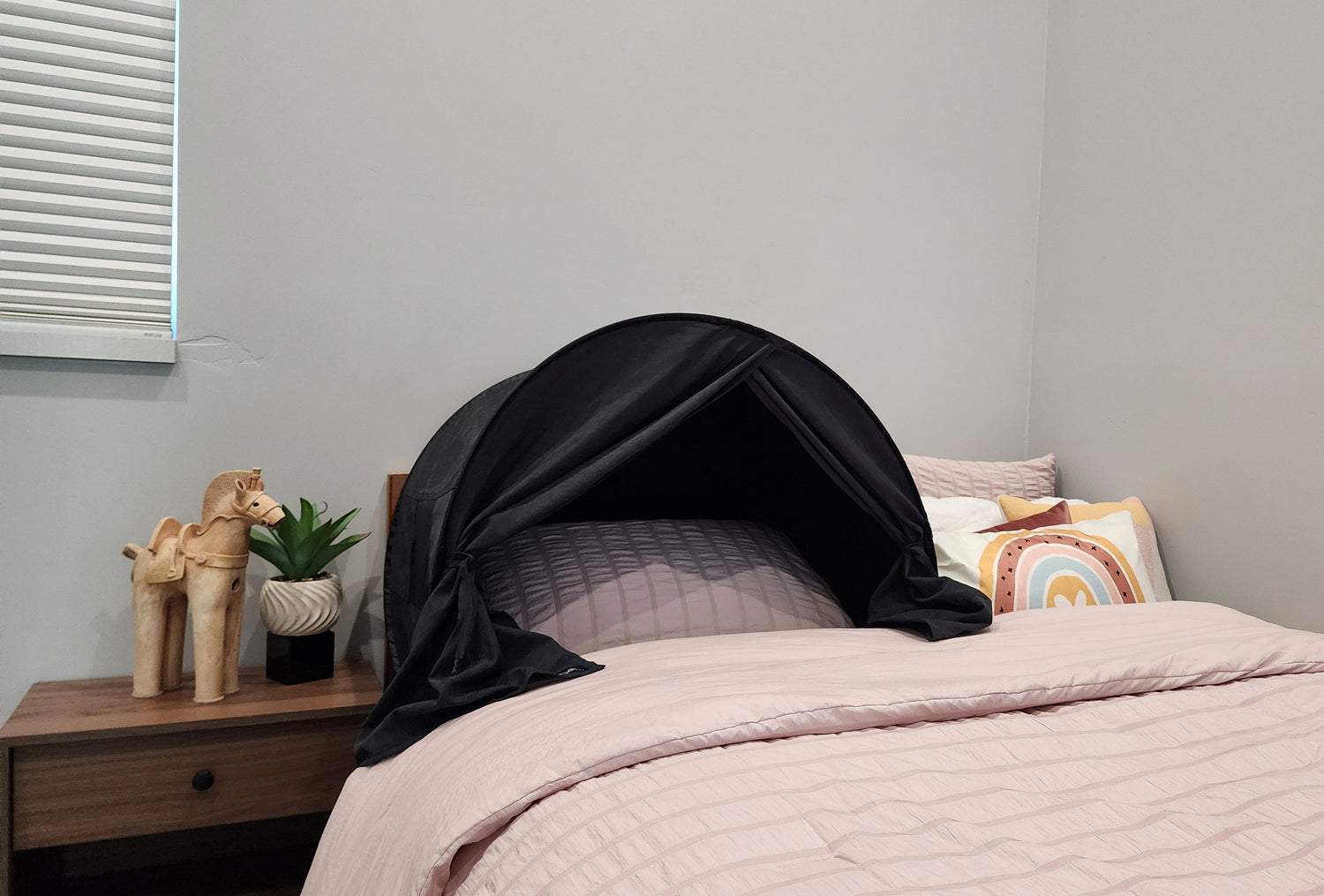 Image: zDen sleep tent on a bed, representing improved sleep quality and comfort. Sleep solution for military service members who need dark, portable recovery tents in shared or mobile settings. zDen sleep tent for people who wake up tired, can’t sleep through the night, or need relief from light sensitivity.