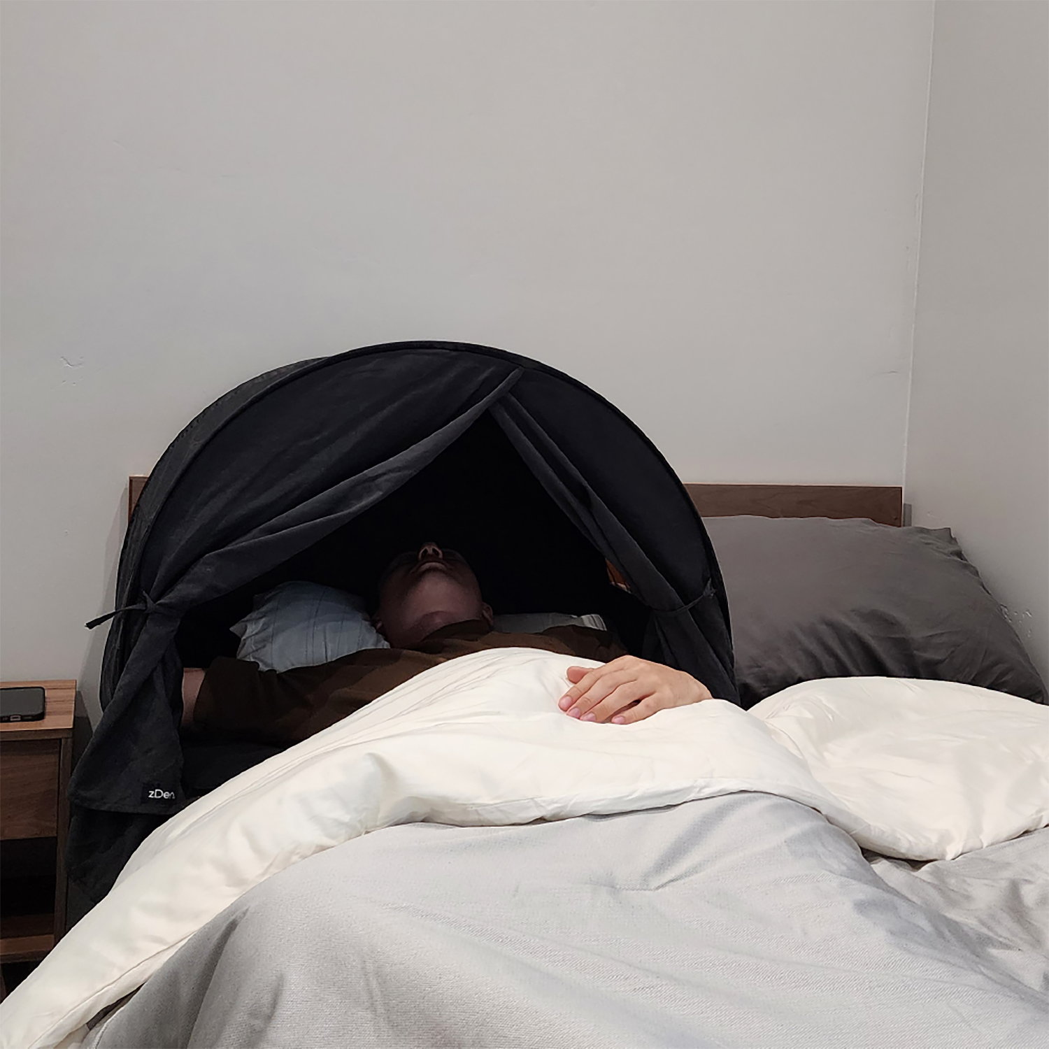Person sleeping in zDen sleep den during daylight